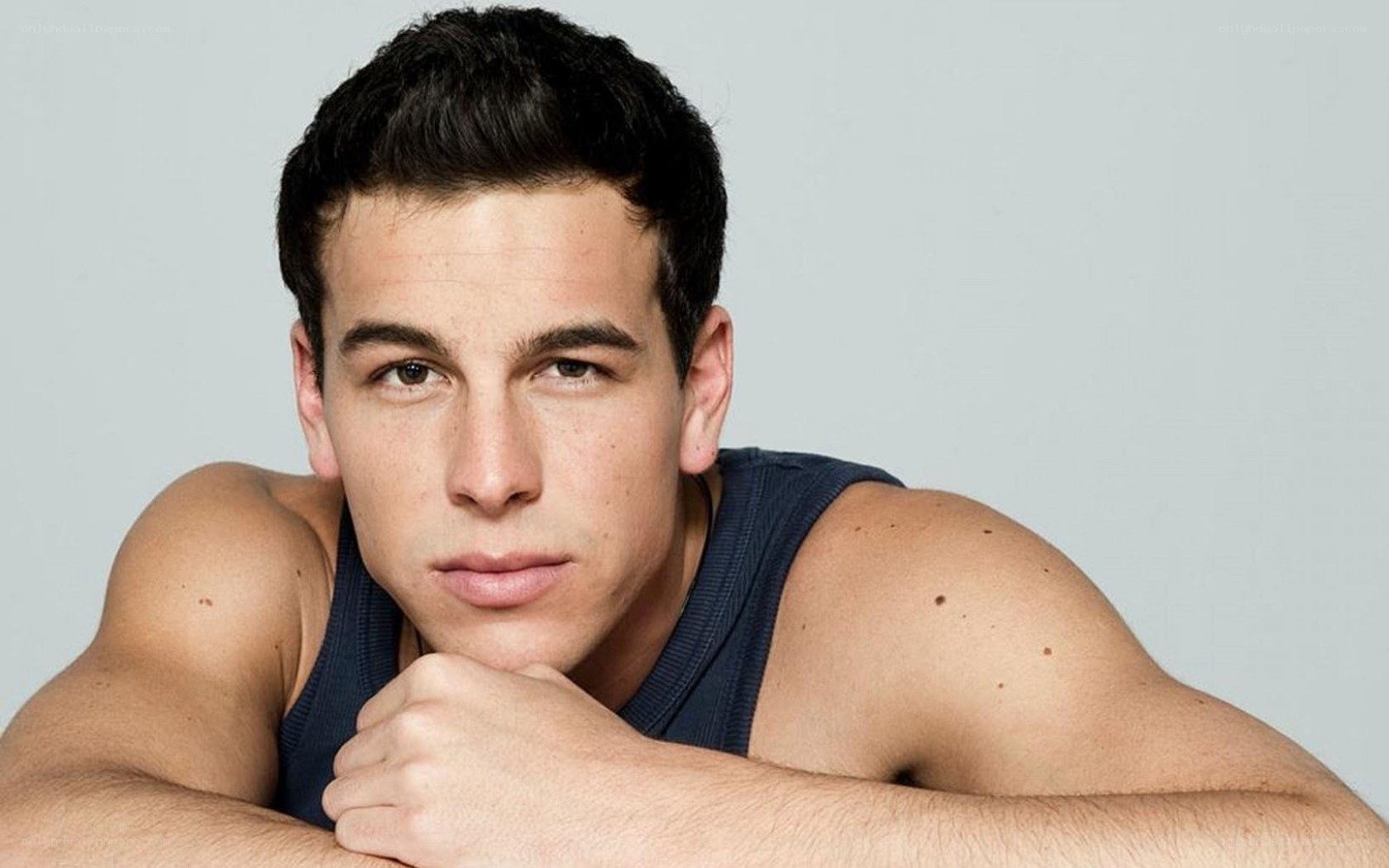 man in blue tank top