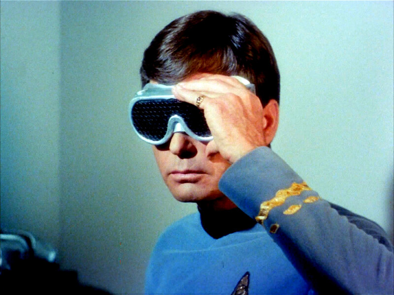 man in blue uniform with goggles