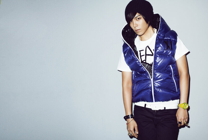 man in blue vest and beanie