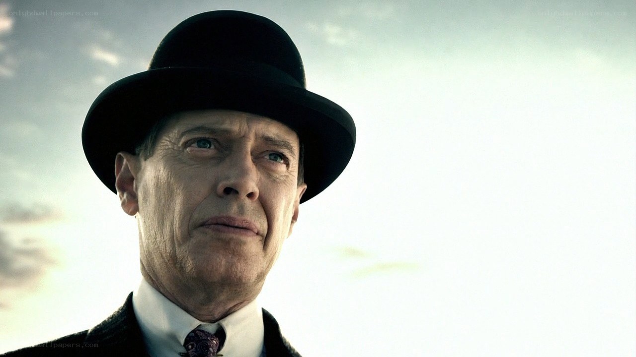 man in bowler hat looking up