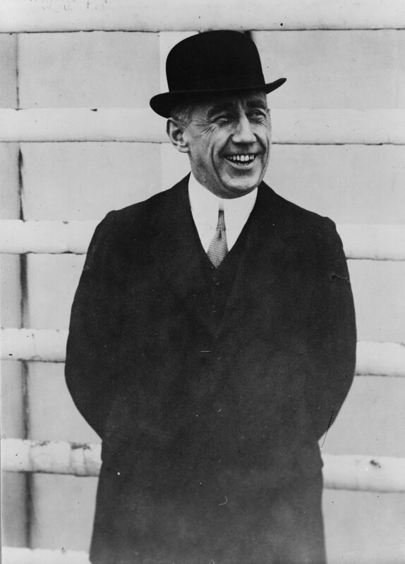 Man in bowler hat smiling