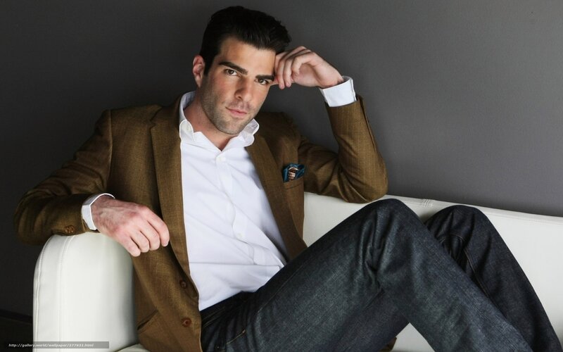 man in brown blazer sitting