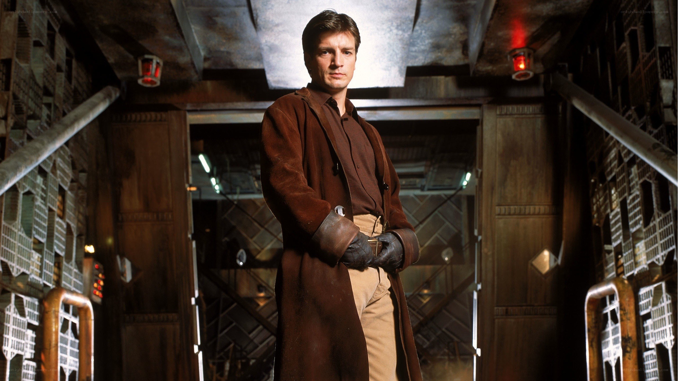 man in brown coat standing