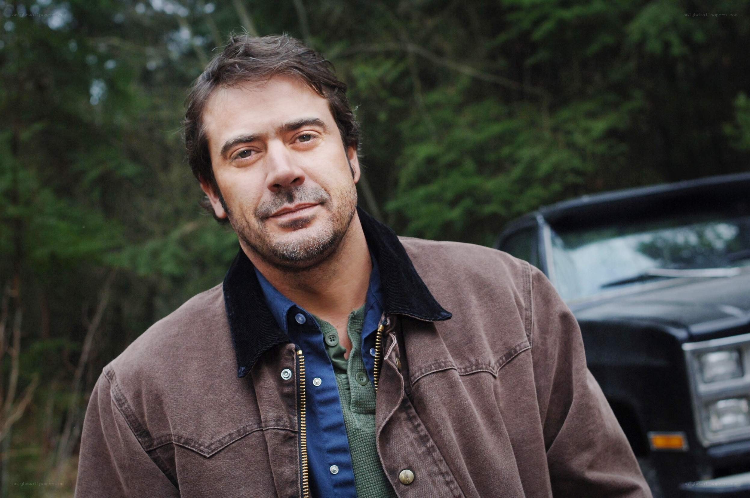 man in brown jacket outdoors