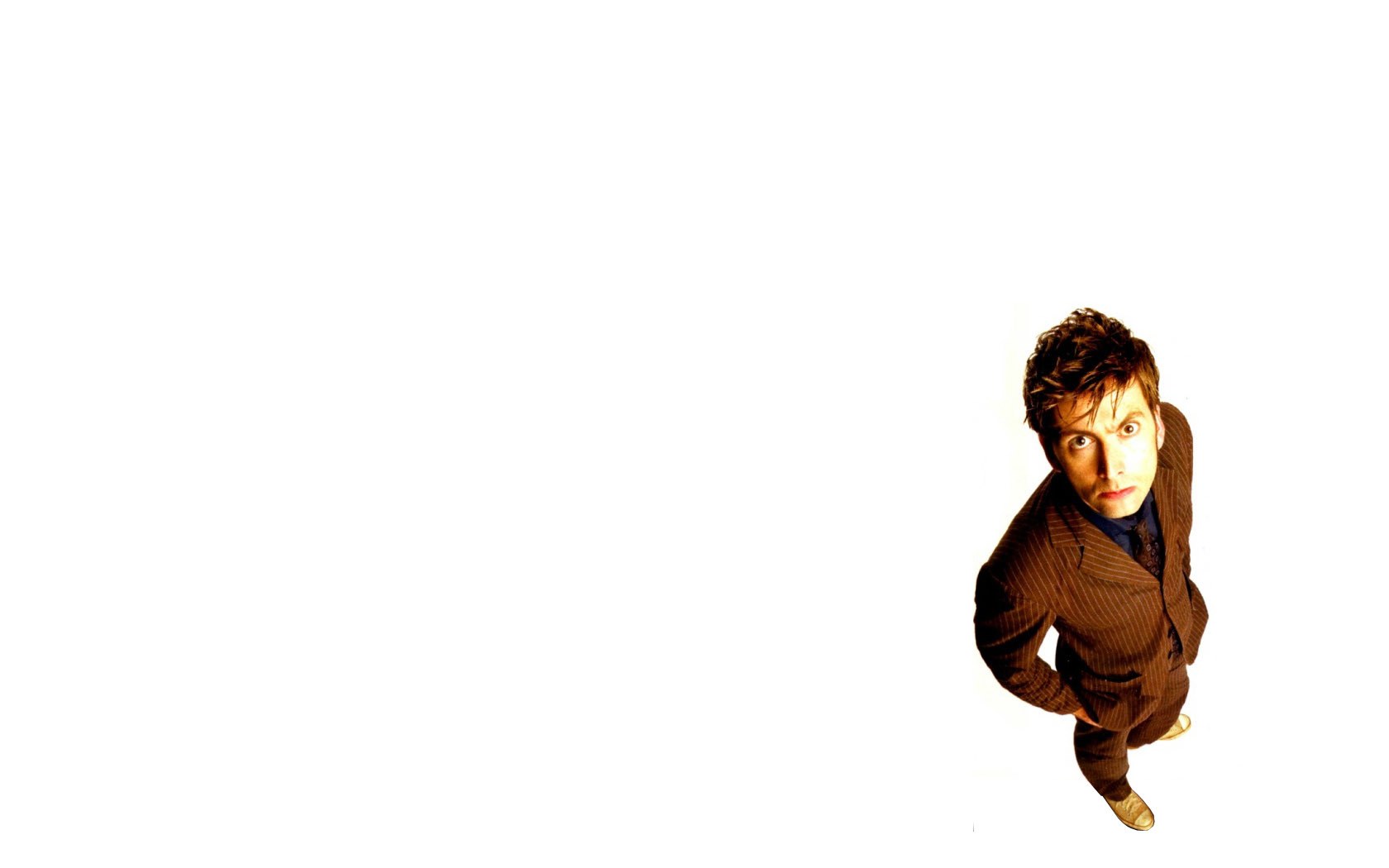 man in brown suit looking up