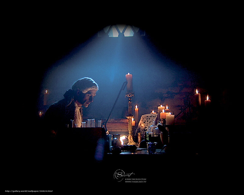 man in candlelit study
