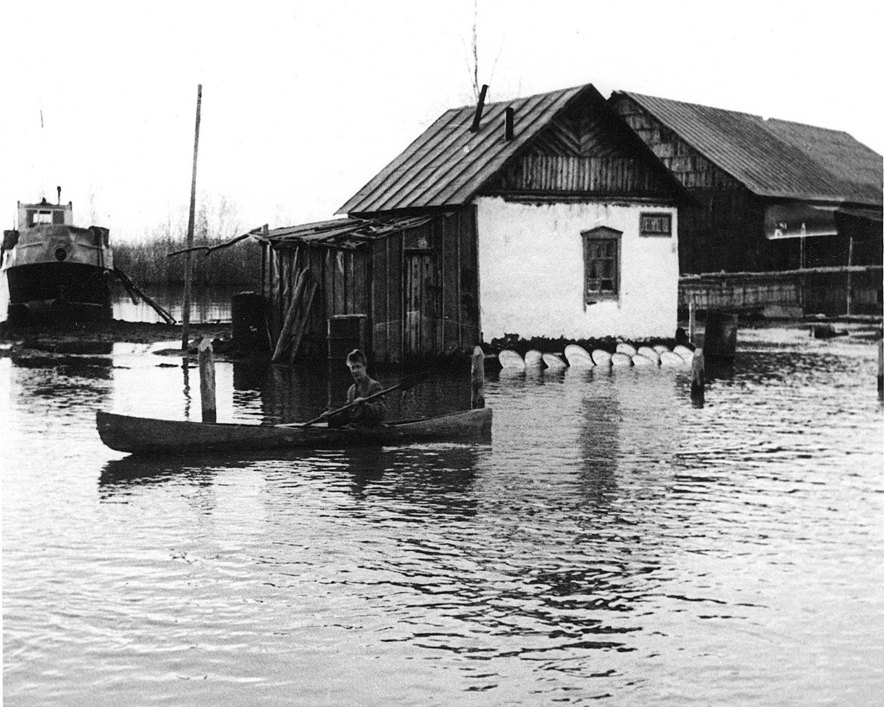 Man in canoe during flood