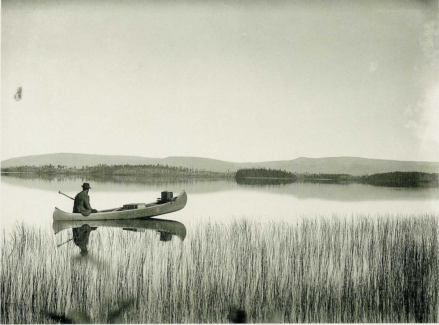 Man in canoe on a lake