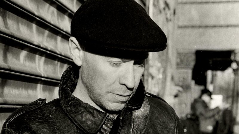 man in cap and leather jacket