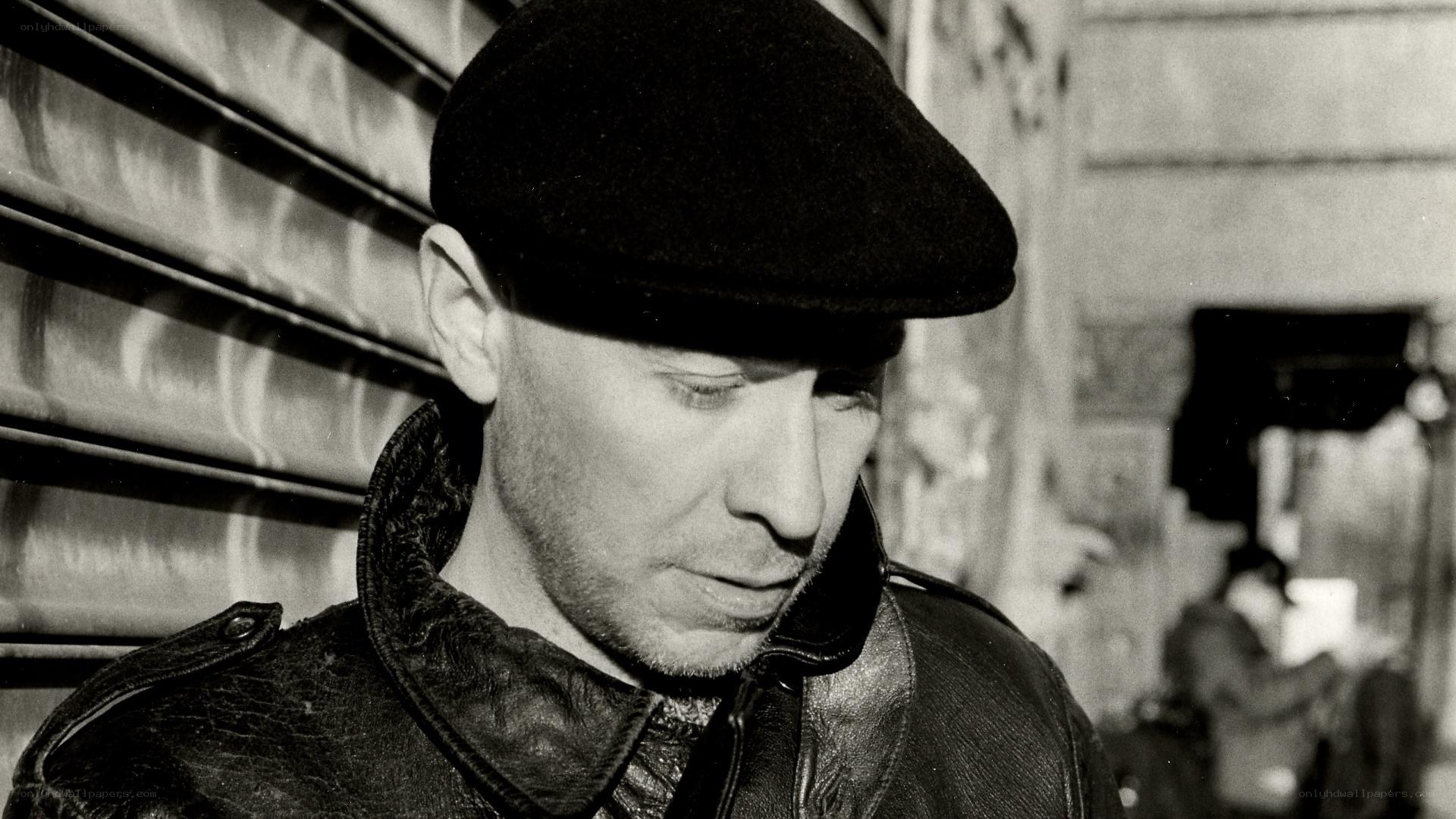 man in cap and leather jacket
