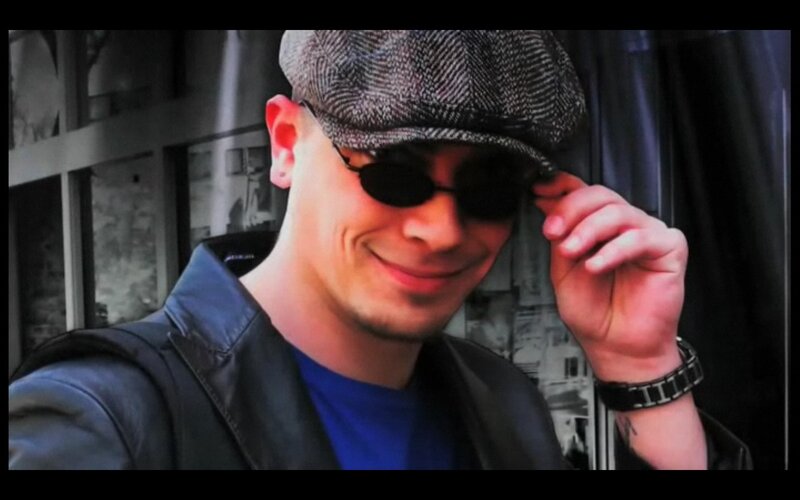 man in cap and sunglasses