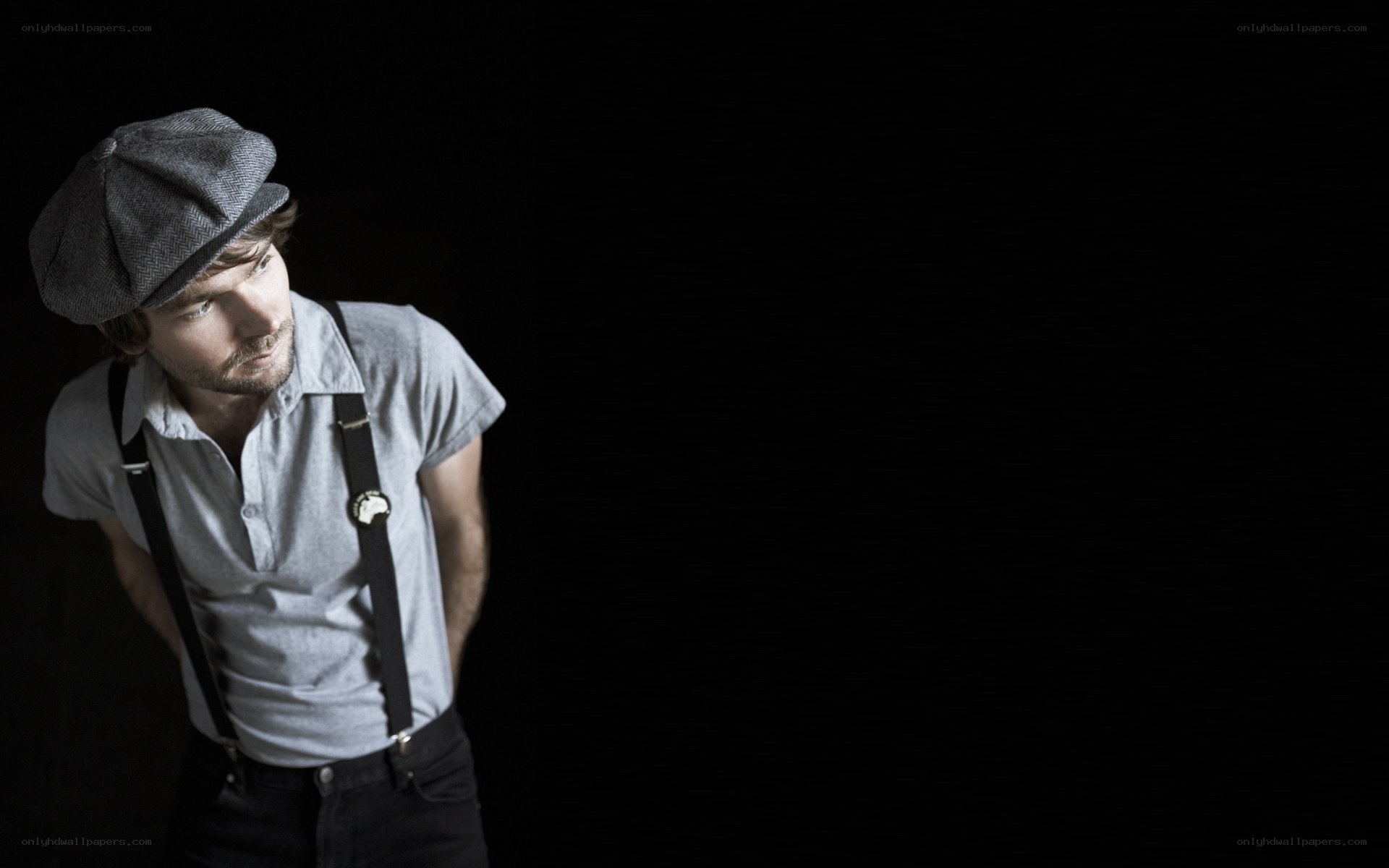 man in cap and suspenders
