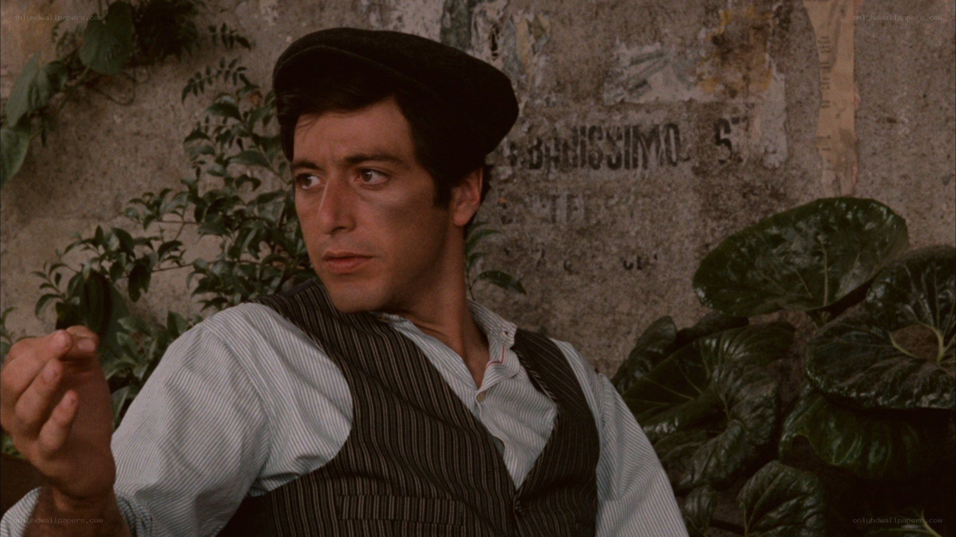 man in cap and vest