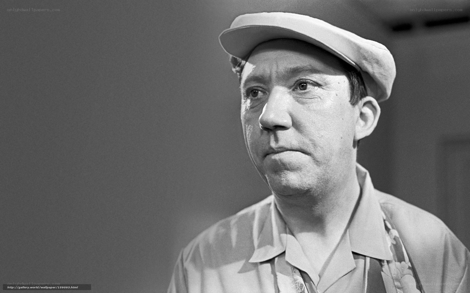 man in cap looking away