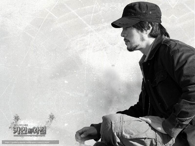 man in cap sitting on ice