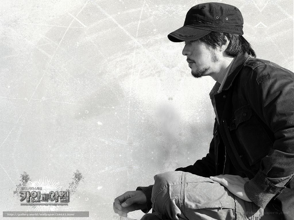 man in cap sitting on ice