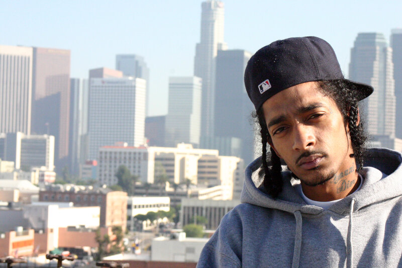 man in cap with city skyline