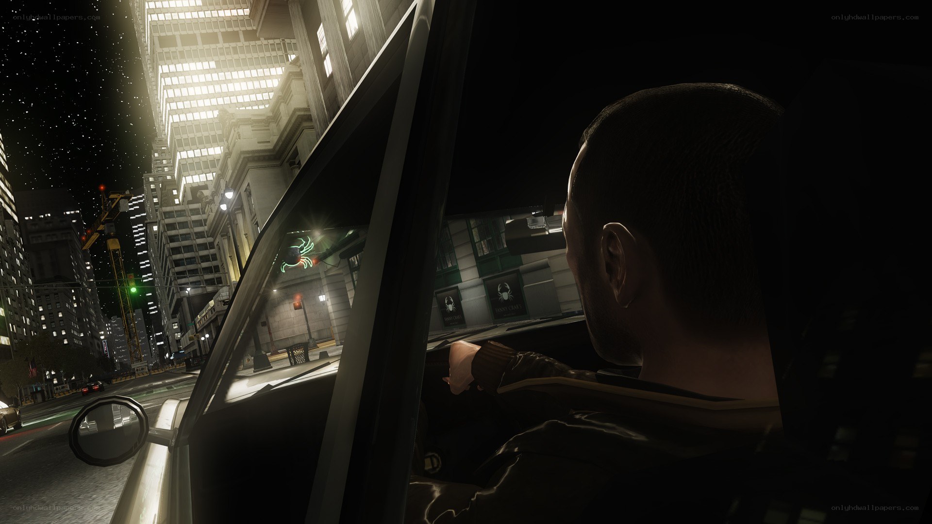 man in car at night city