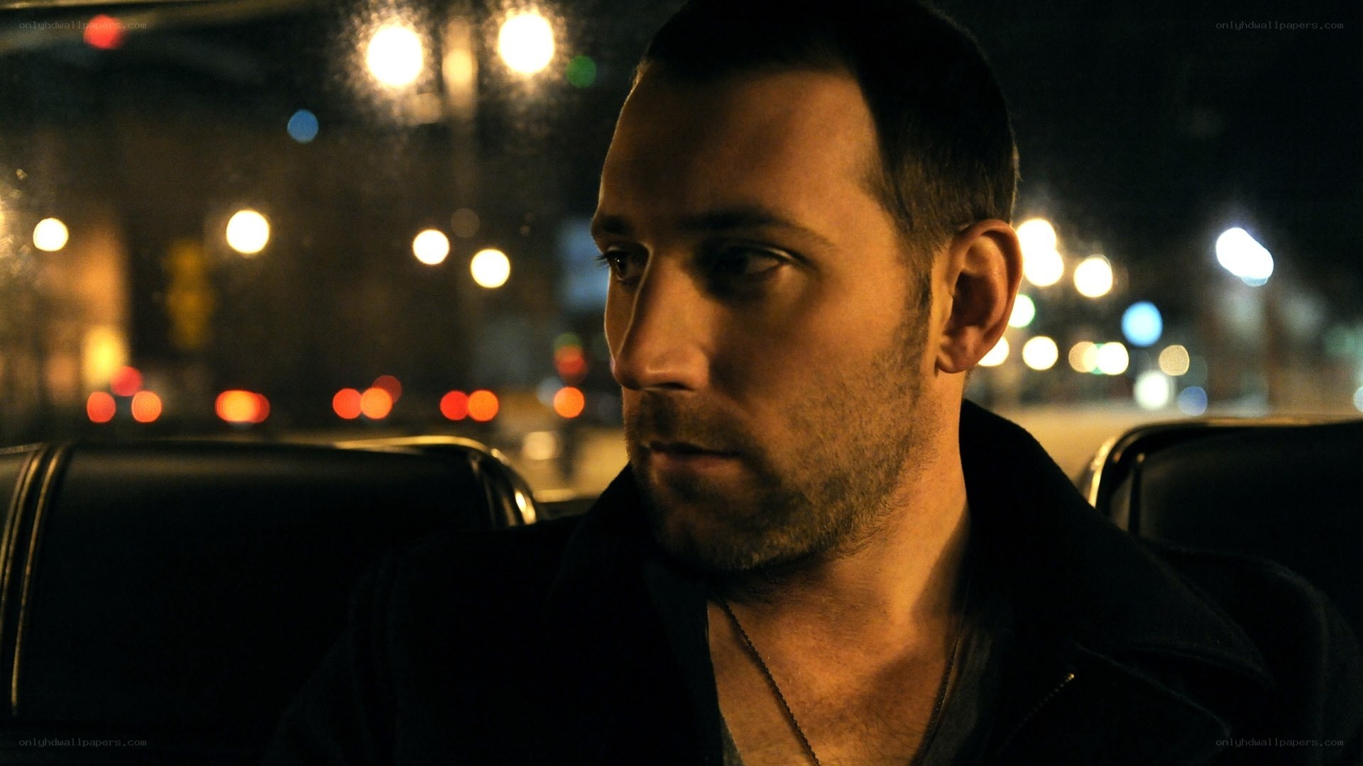 man in car at night