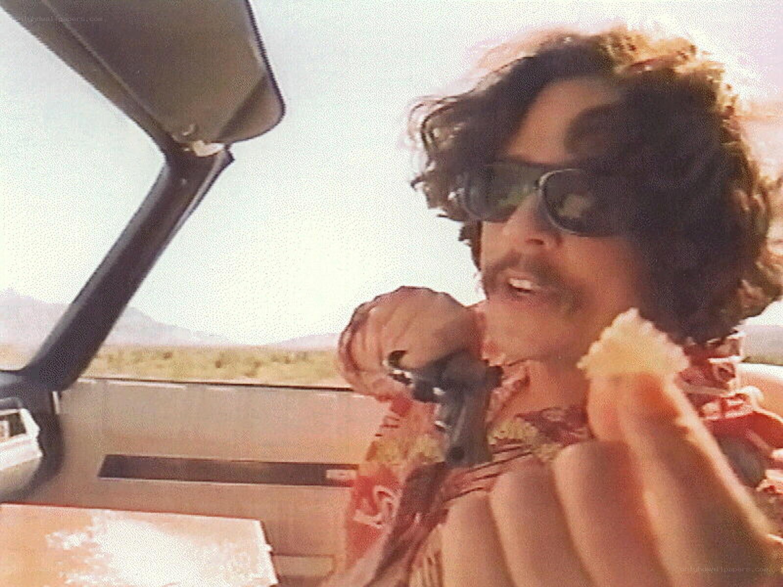 man in car eating snack