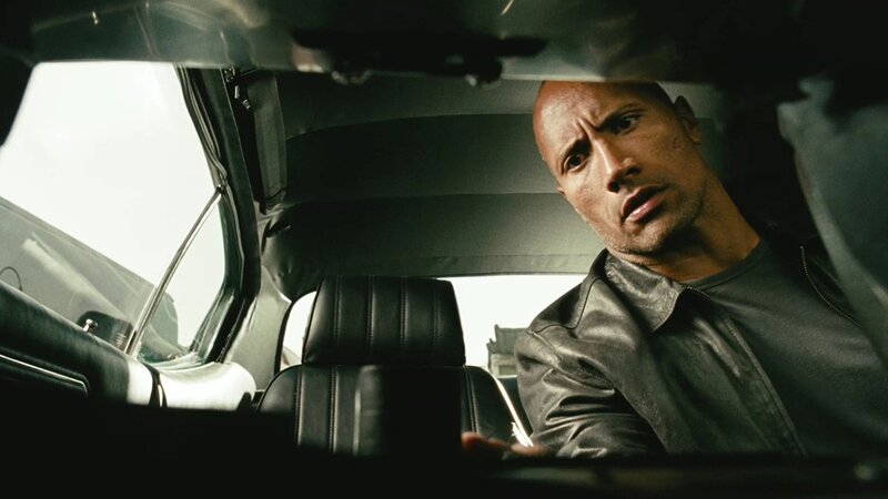man in car looking back