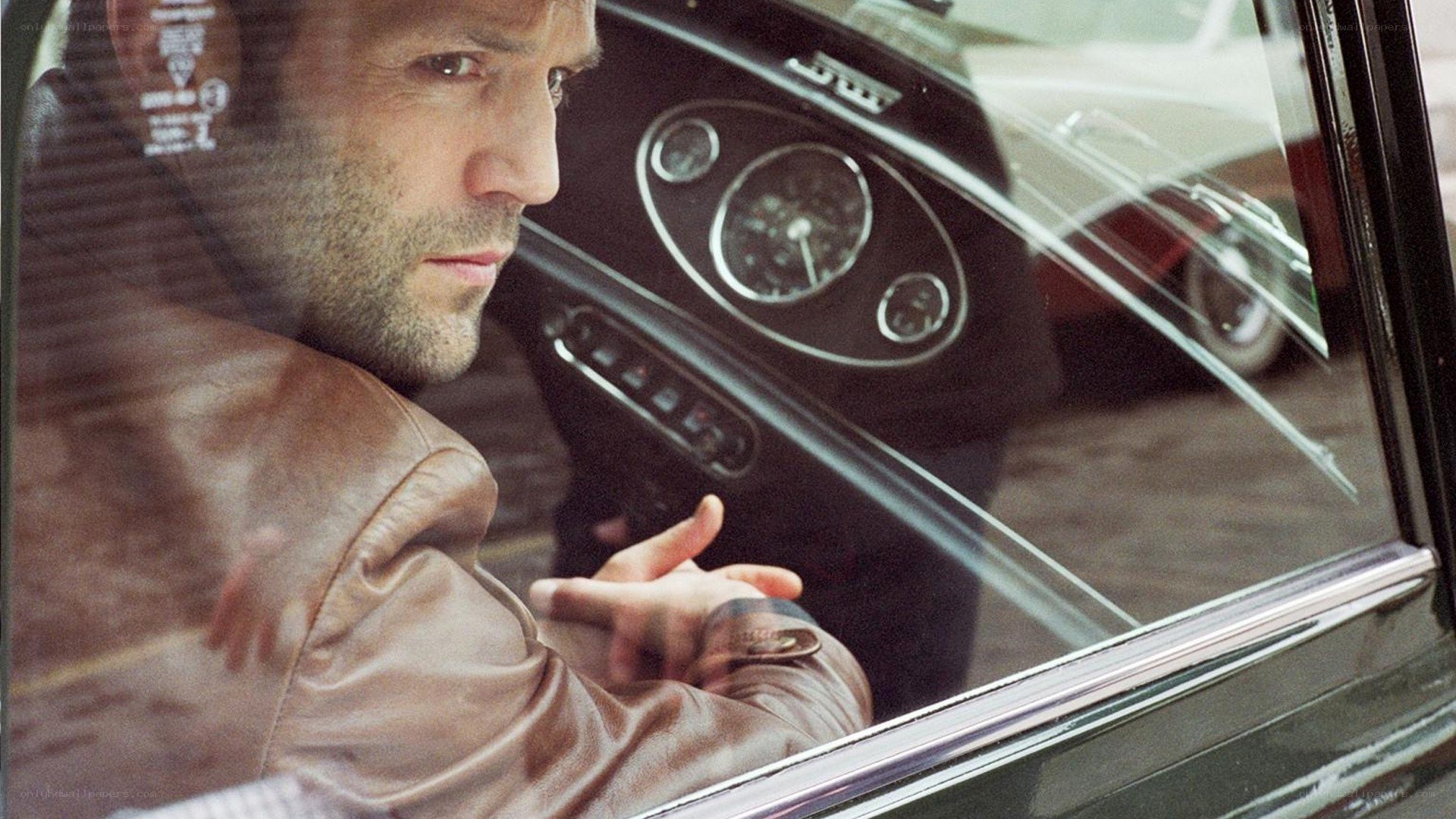 man in car looking out window