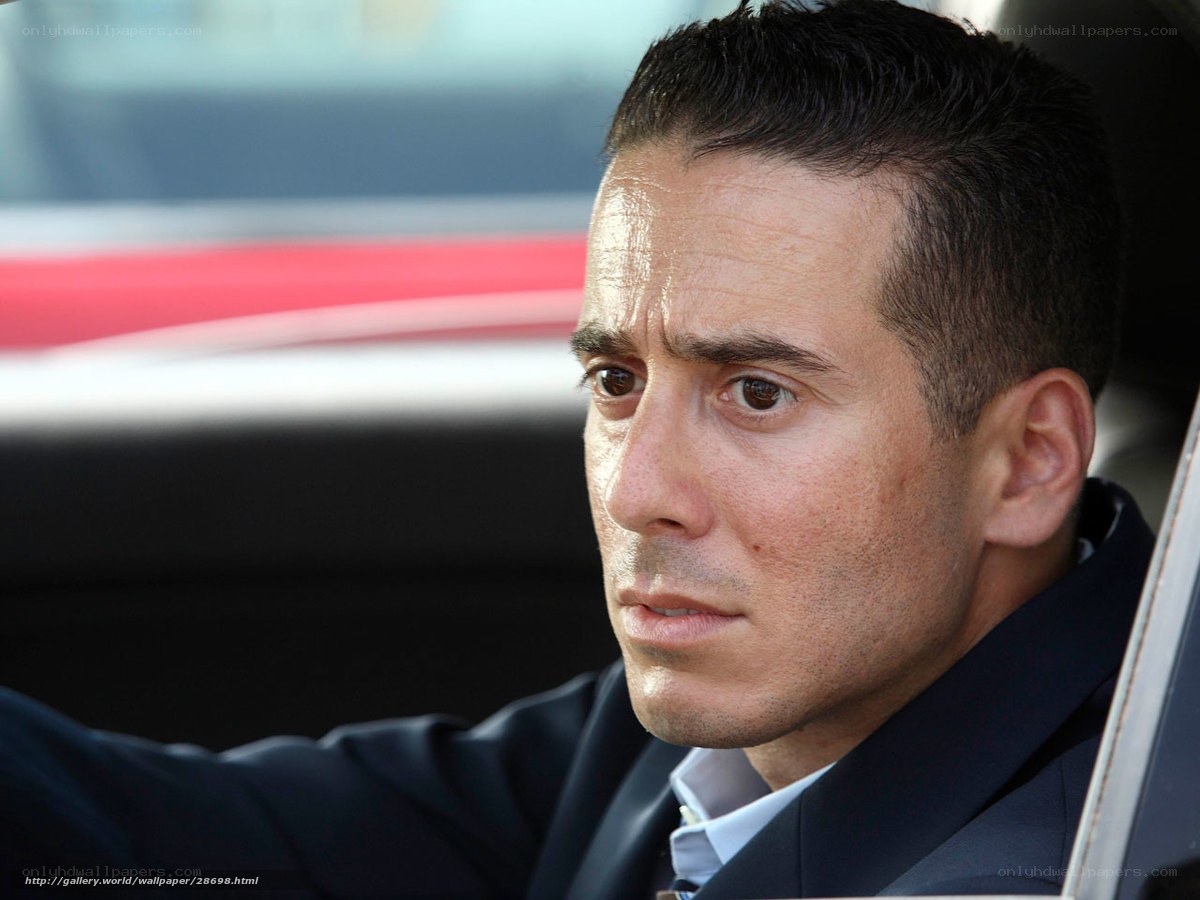 man in car looking serious