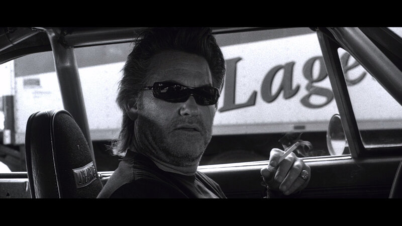 man in car smoking cigarette
