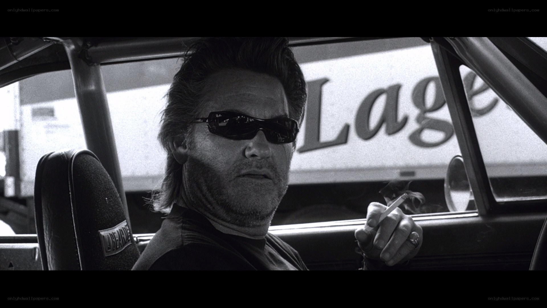 man in car smoking cigarette