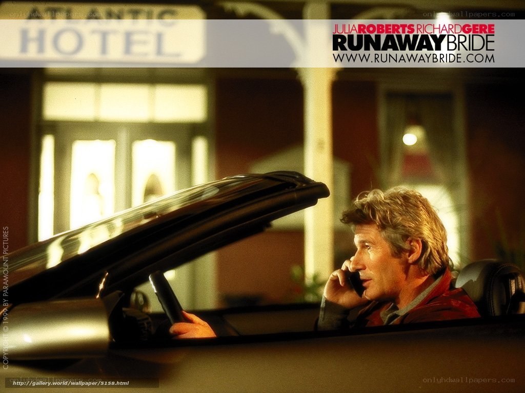 man in car talking on phone