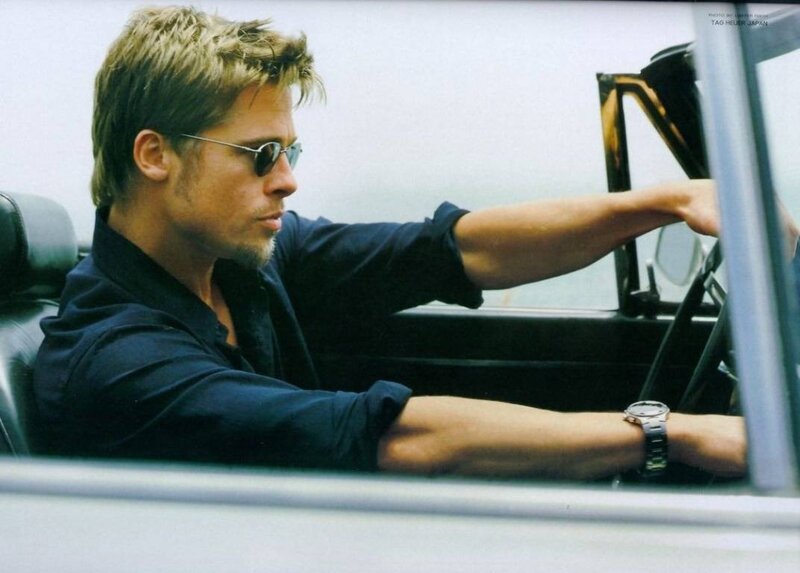 man in car wearing sunglasses
