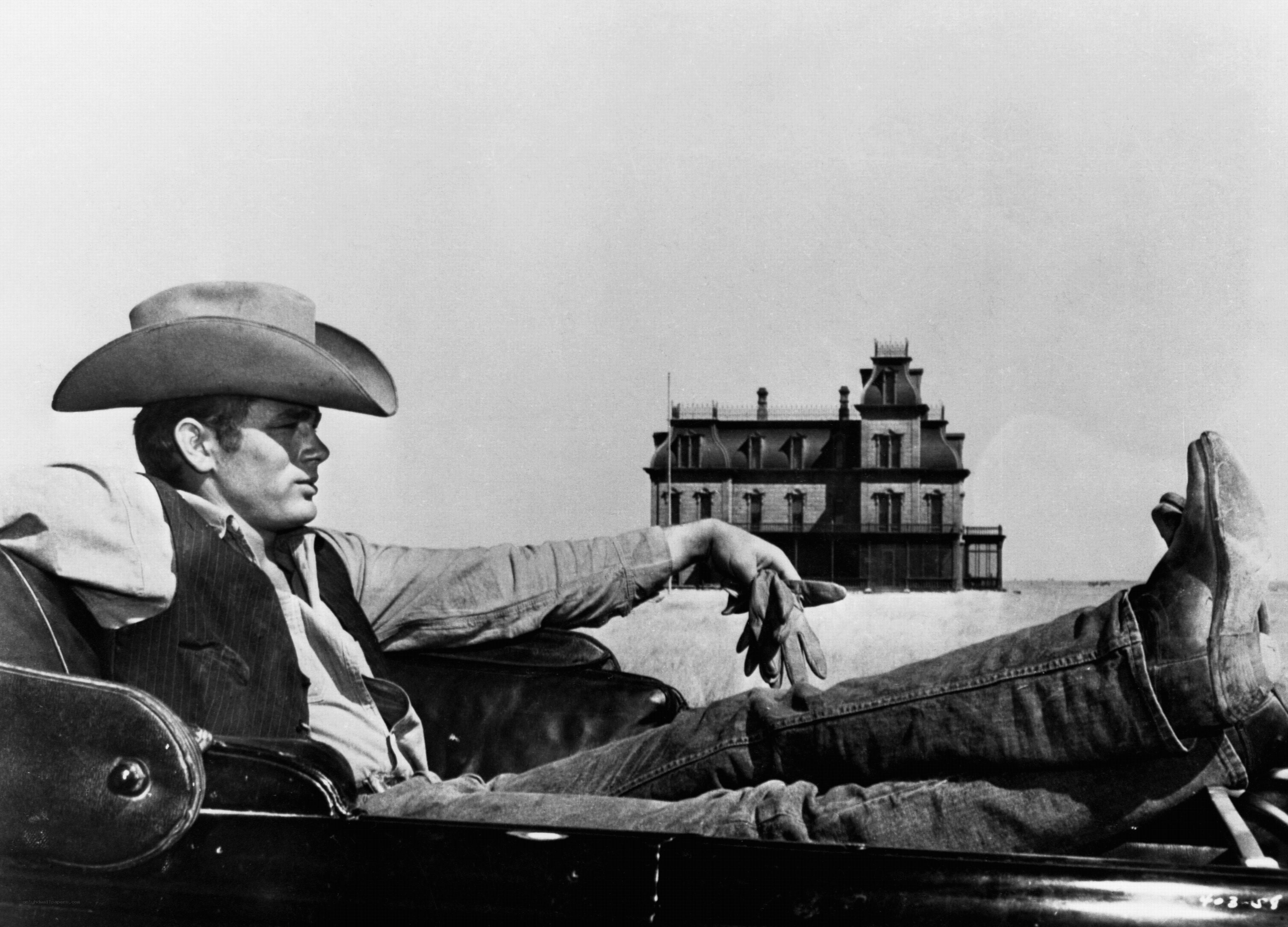 Man in car with cowboy hat