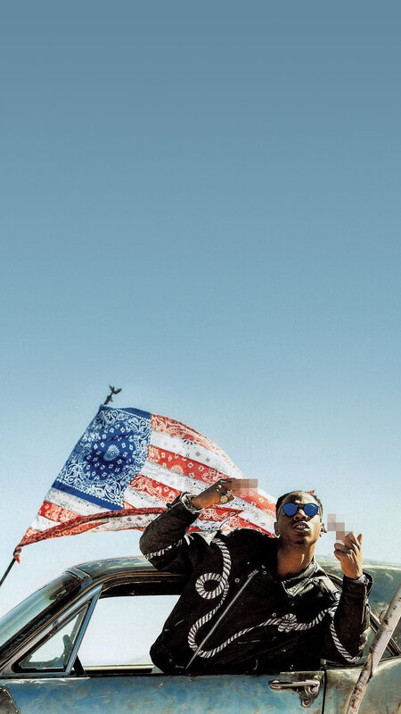 Man in Car with Flag