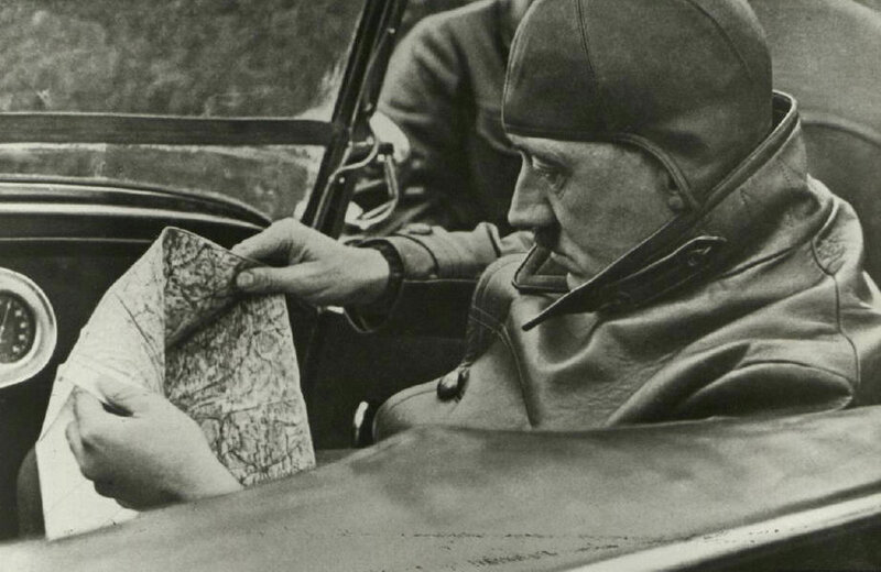 Man in car with map