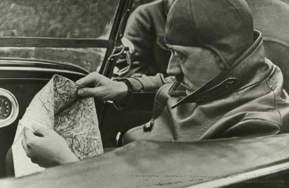 Man in car with map