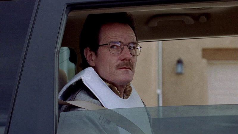 man in car with neck brace