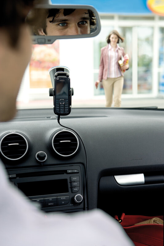 Man in car with phone mount