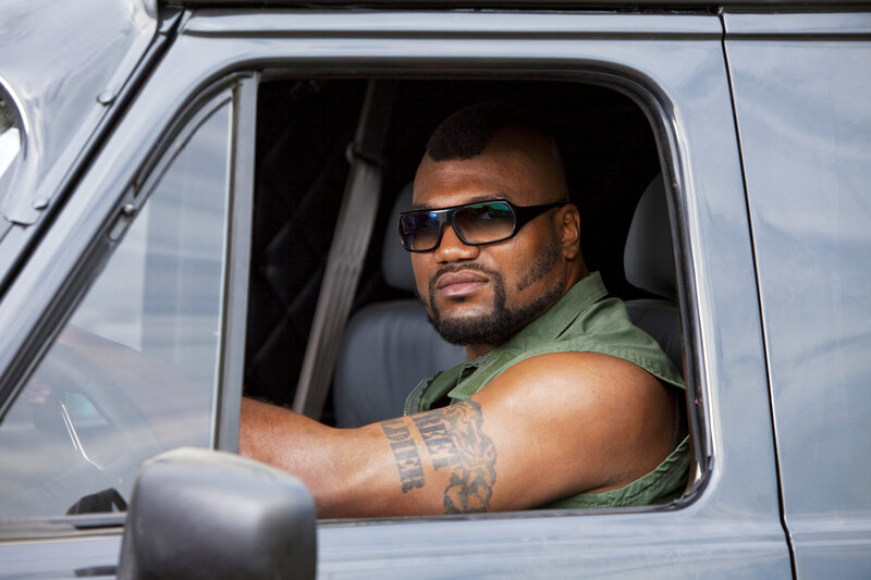man in car with sunglasses