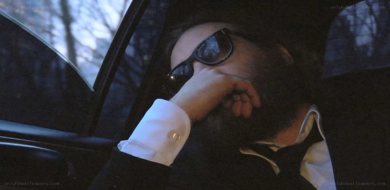 man in car with sunglasses