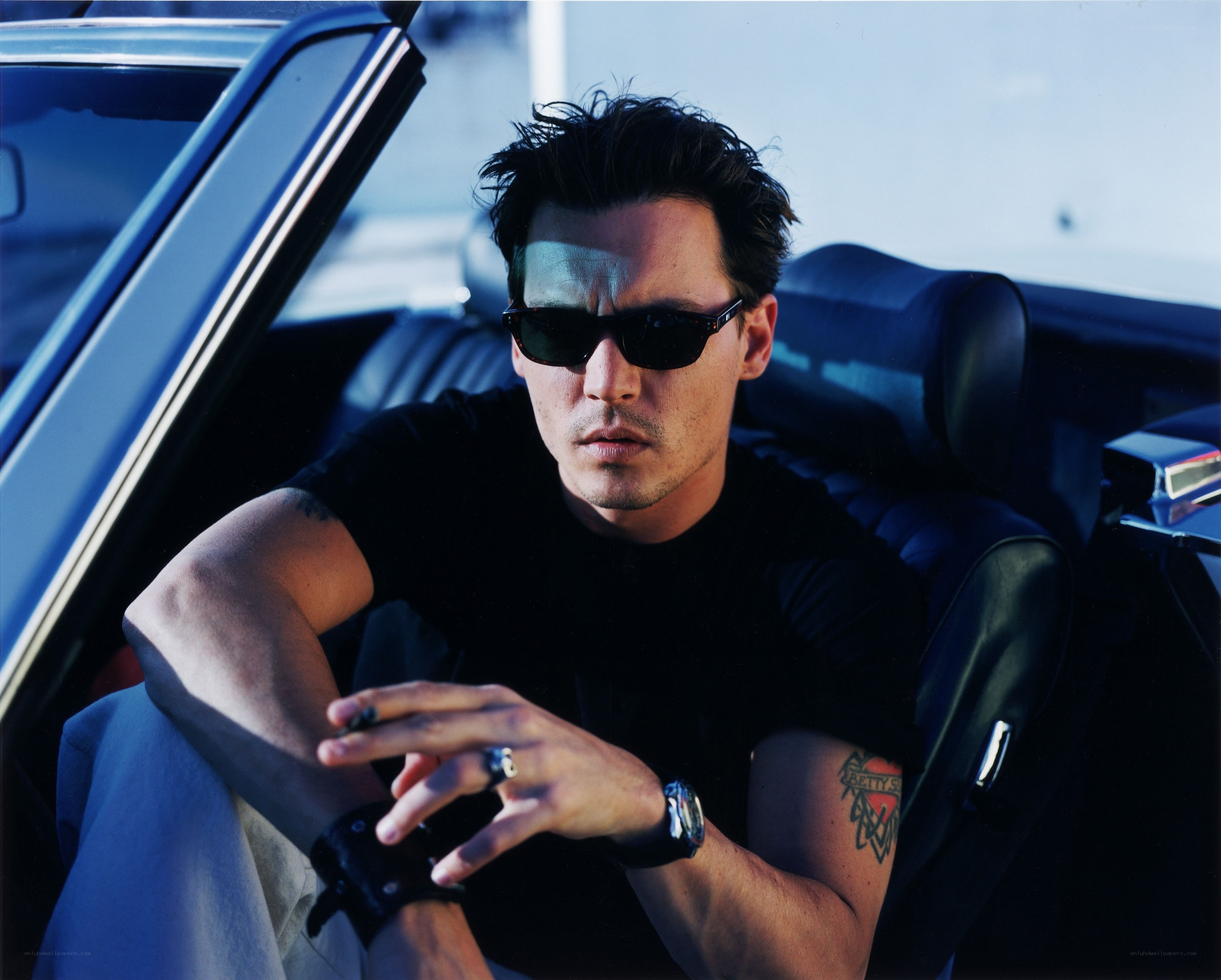 man in car with sunglasses