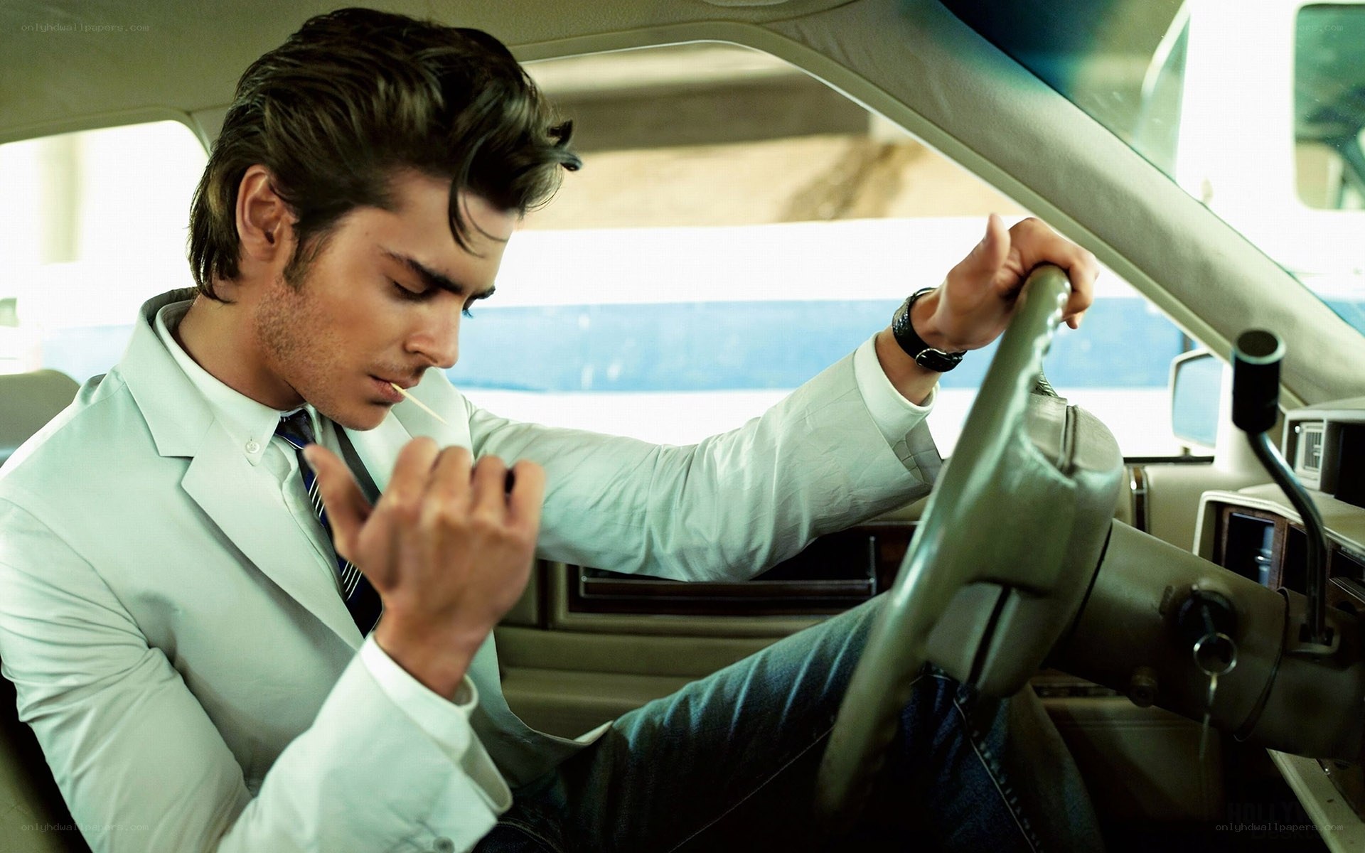 man in car with toothpick