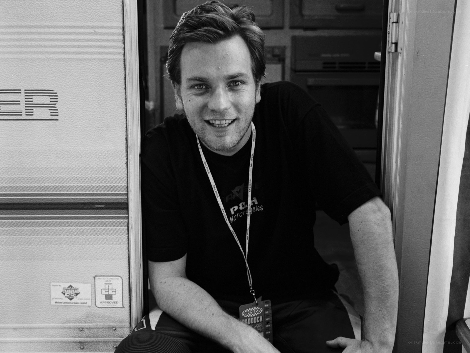 man in caravan doorway