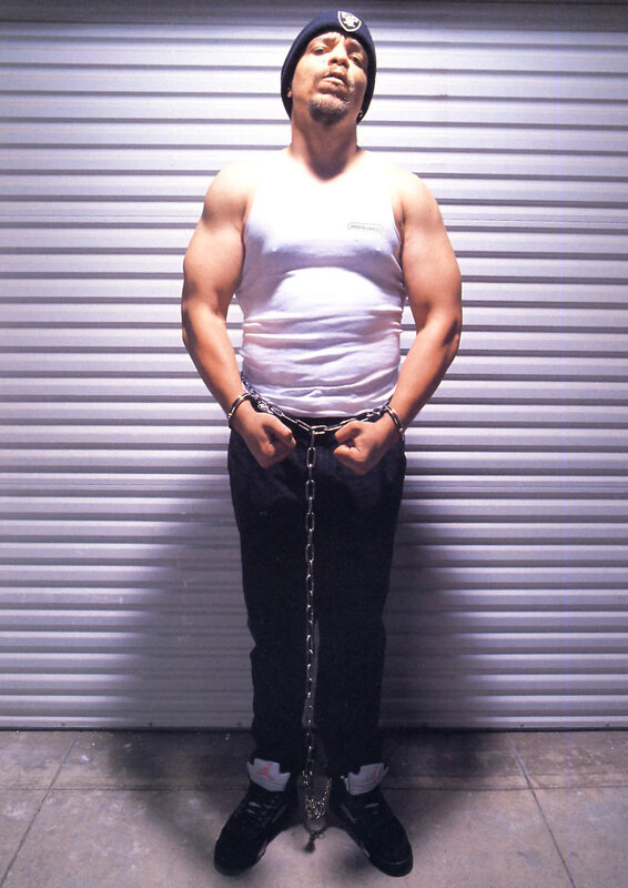 Man in chains against garage door