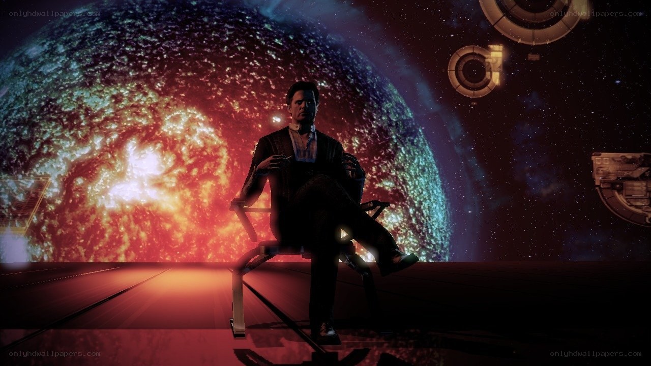 man in chair with planet background