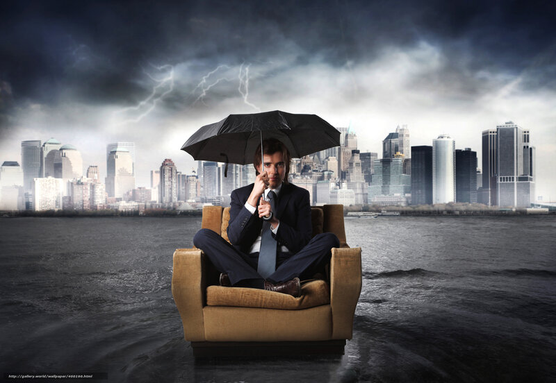 Man in chair with umbrella