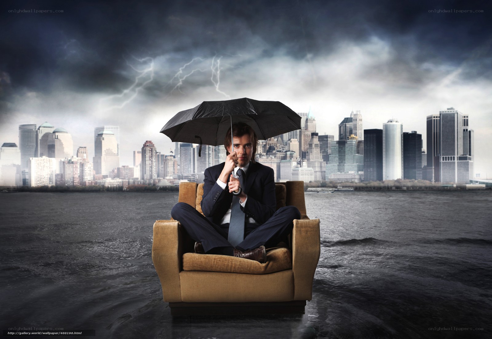 Man in chair with umbrella