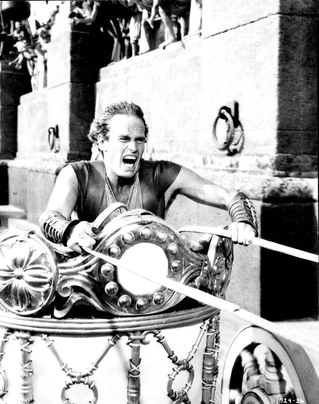man in chariot shouting