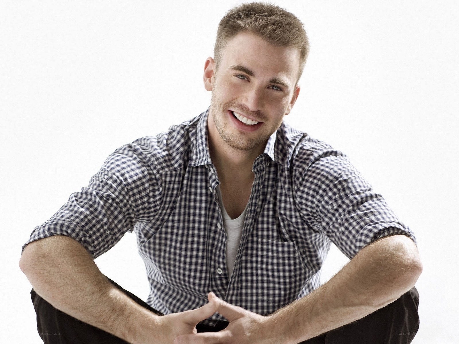 man in checkered shirt smiling