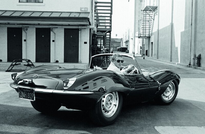 Man in classic car on street