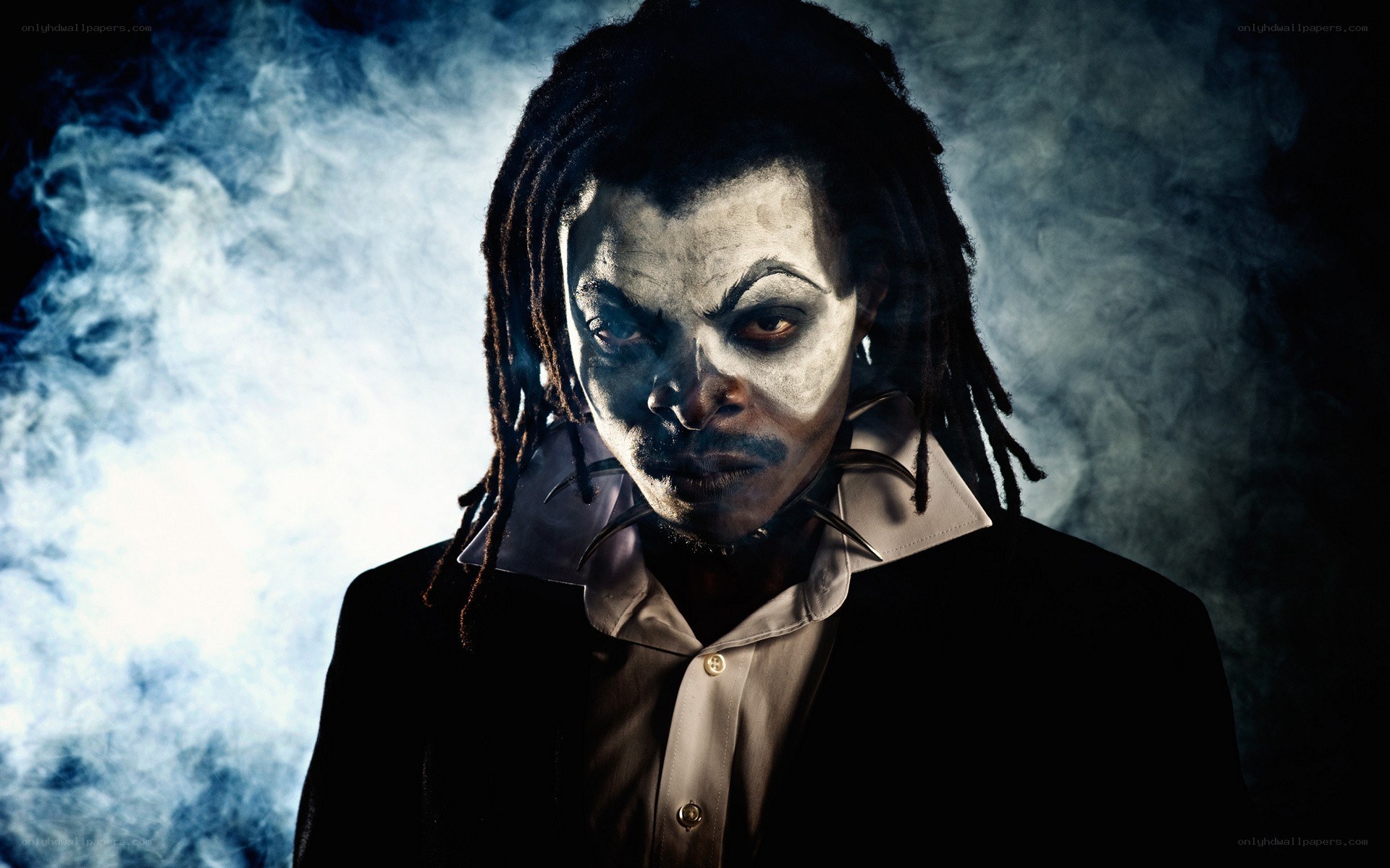 man in clown makeup with dreadlocks
